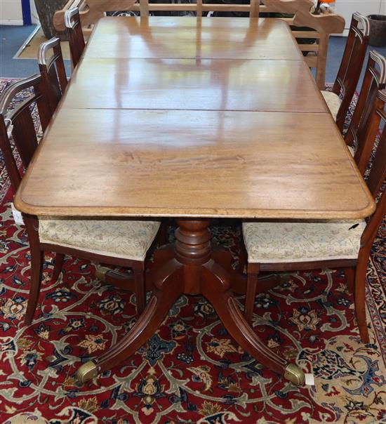 A Regency mahogany twin pillar dining table W.210cm